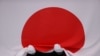 The Japanese national flag is seen before it flies at a medal ceremony dring the 2020 Olympics in Tokyo, Japan. 